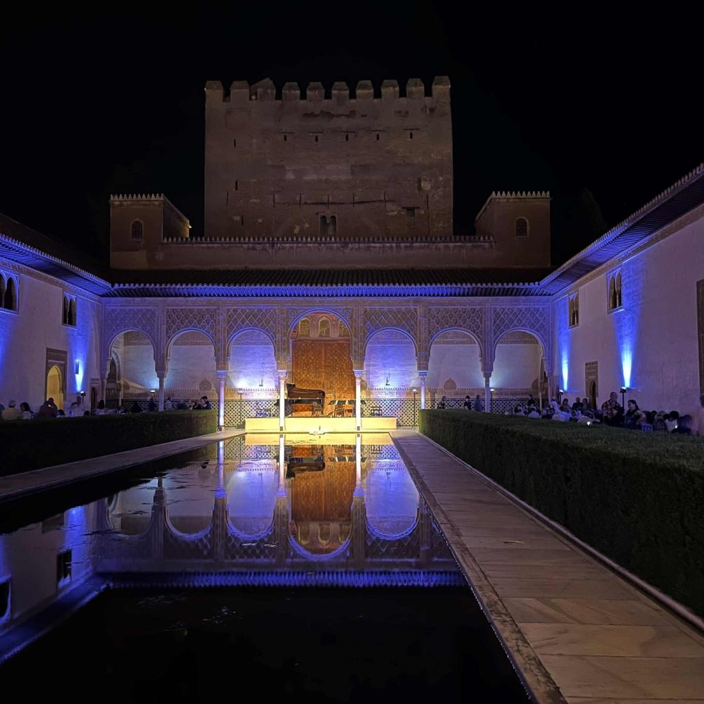 Patio de los Arrayanes in the Alhambra set up for a classical music concert
