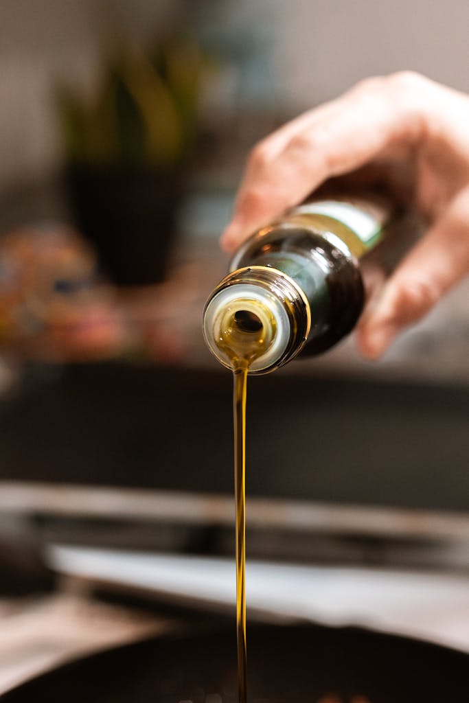 Olive oil being poured into a pan